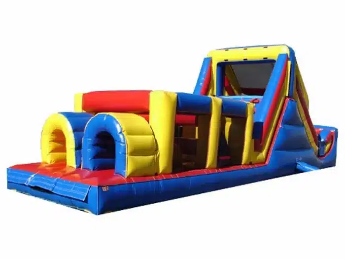 Large inflatable obstacle course with tunnels, climbing wall, and slide in bright red, yellow, and blue. Perfect for events. Buy this fun course online today!